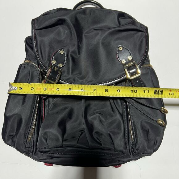 MZ Wallace Marlena backpack in black nylon and leather with red accents.